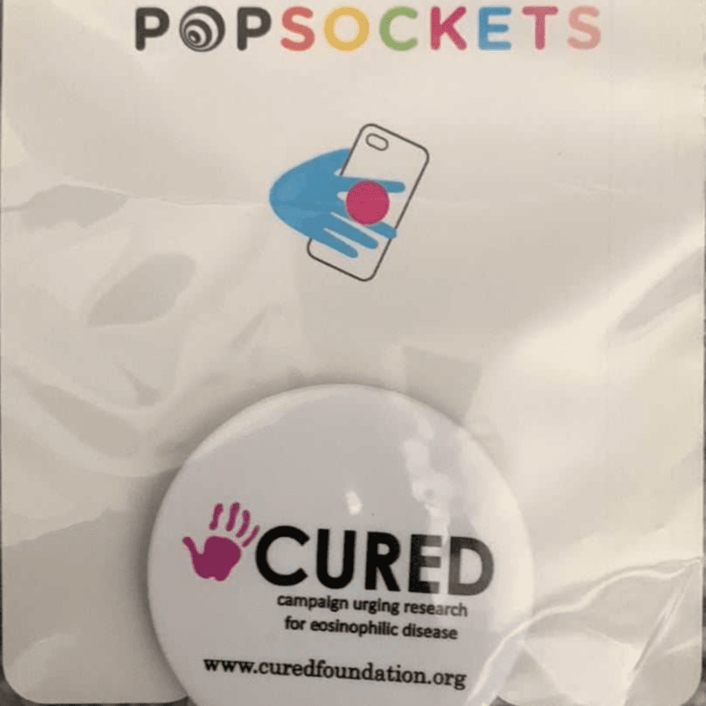 PopSockets package with CURED foundation logo.
