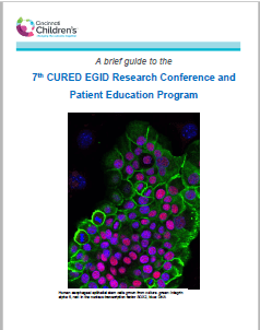 Conference brochure cover with fluorescent-stained cells